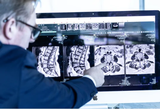 How is a lumbar microdiscectomy performed